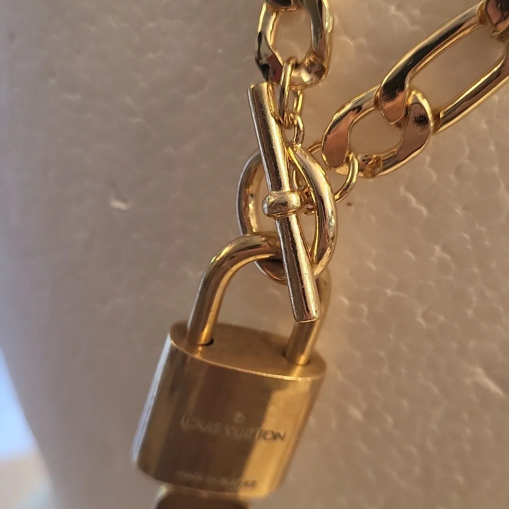 Louis vuitton trio shined by them gorgeous gold plated chocker lock key numbered
